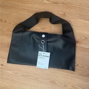 The New Studio Solid Black Bag